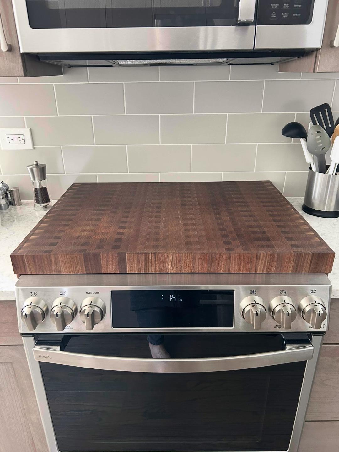 A Walnut cook top cover